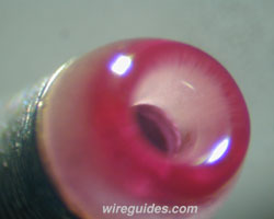 wire guide-ruby exit of a coil wiing nozzle